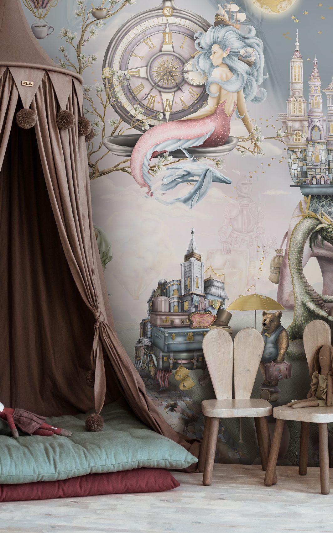 Beautiful girls bedroom design with magical fairy tale wallpaper featuring story book illustrations. Bedroom design has a stage play set up with tent canopy. In colours of pink purple gold sage green wood etc.
