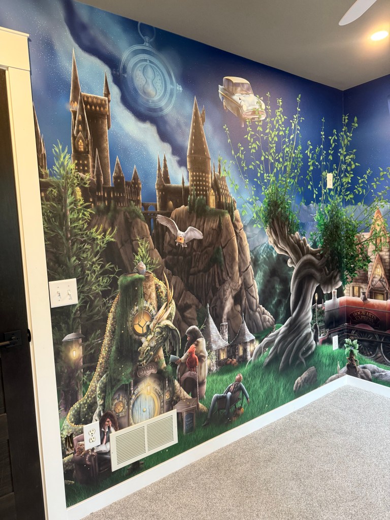 Harry Potter Wizard Wallpaper installed with commercial unpasted premium wallpaper in a nursery bedroom